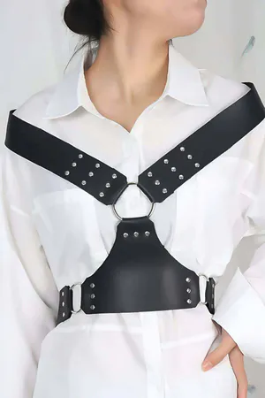 Black faux leather studded chest harness with silver O-ring detail