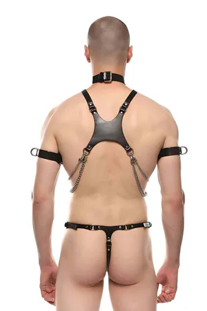 Black faux leather body harness with silver O-ring, layered chains, choker, and adjustable armbands.