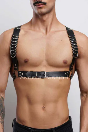Black faux leather chest harness with silver rings and adjustable straps