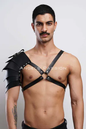 Black faux leather shoulder harness with layered armor design and adjustable chest straps