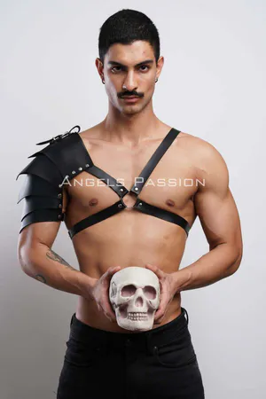 Black faux leather shoulder harness with layered armor design and adjustable chest straps