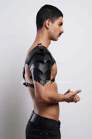 Black faux leather shoulder harness with layered armor design and adjustable chest straps