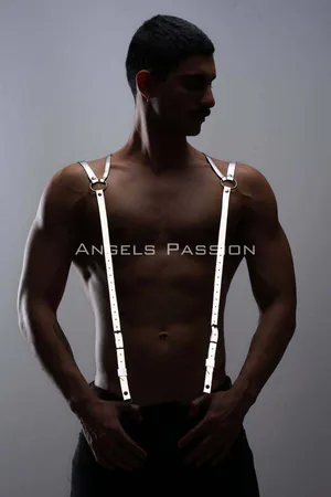 Silver reflective shoulder harness with O-ring detail worn by a person, adjustable straps