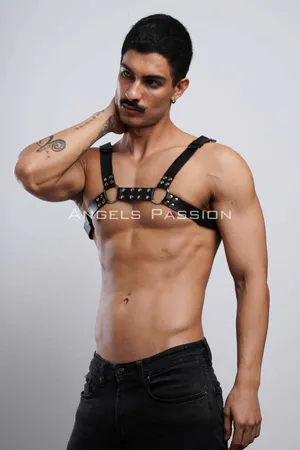 Black faux leather studded chest harness with silver O-ring details