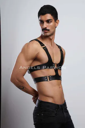 Black faux leather chest harness with O-ring detail and adjustable straps