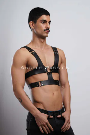 Black faux leather chest harness with O-ring detail and adjustable straps