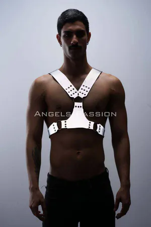 Silver reflective chest harness with O-ring accents worn by a model