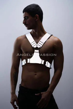 Silver reflective chest harness with O-ring accents worn by a model