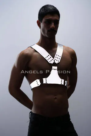 Silver reflective chest harness with O-ring accents worn by a model