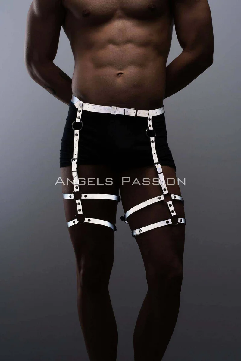 Reflective thigh harness close-up showing strap adjustability and D-ring detail.