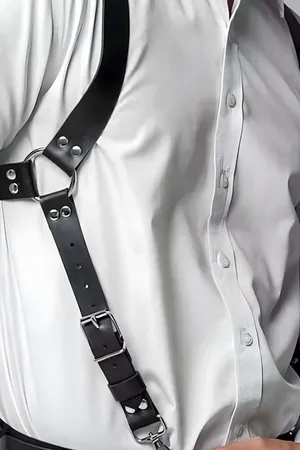 Black faux leather adjustable shoulder harness worn by a person