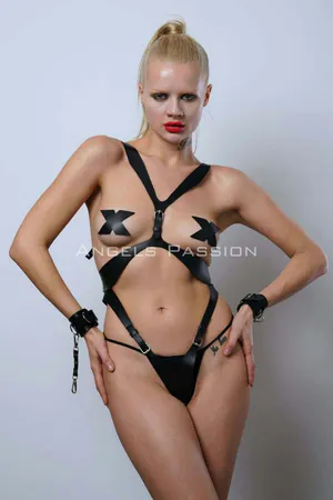 Black vegan leather full body harness with adjustable straps and matching wrist cuffs