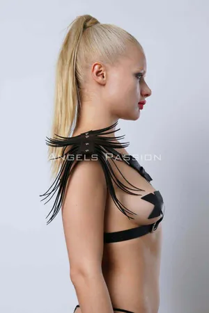 Black faux leather shoulder harness with cascading fringe detail on model's back