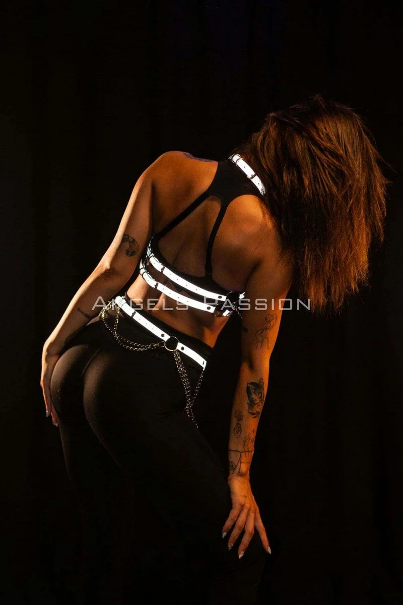 Festival outfit idea featuring the reflective halter harness with black attire.