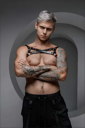 Black faux leather chest harness with O-rings and adjustable straps