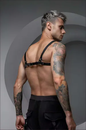 Black faux leather chest harness with O-rings and adjustable straps