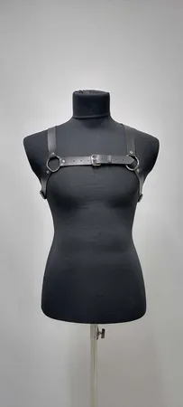 Black faux leather strappy chest harness with O-ring and buckle