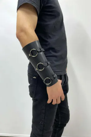 Black faux leather triple O-ring arm cuff with adjustable buckles