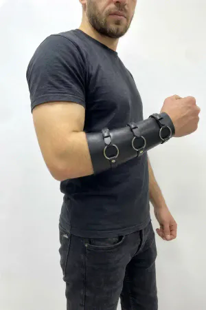 Black faux leather triple O-ring arm cuff with adjustable buckles