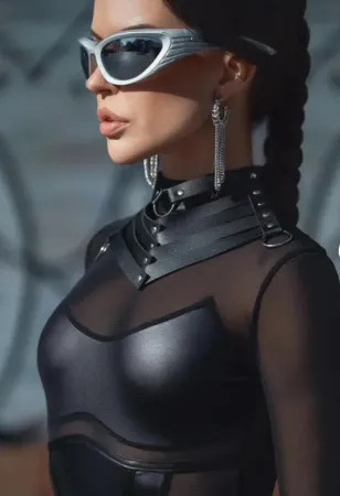 Black faux leather choker with silver pyramid studs and O-ring