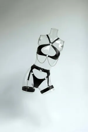 Black Faux Leather Body Harness with Silver Chain Detail and Garter Straps on mannequin