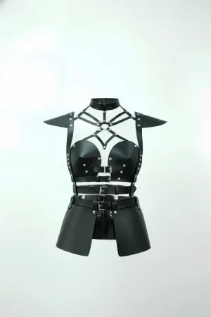 Black studded faux leather body harness with dramatic shoulder armor and adjustable buckle straps