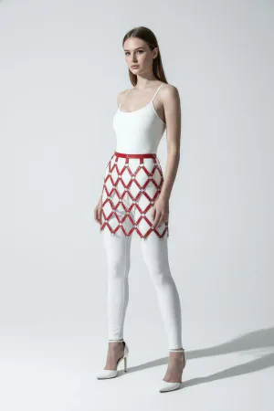 Red diamond grid faux leather skirt harness on a model