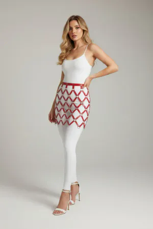 Red diamond grid faux leather skirt harness on a model