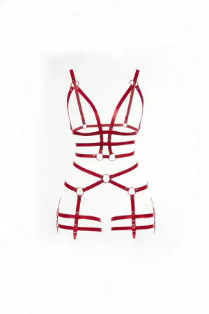 Red faux leather body harness with O-ring details and adjustable straps