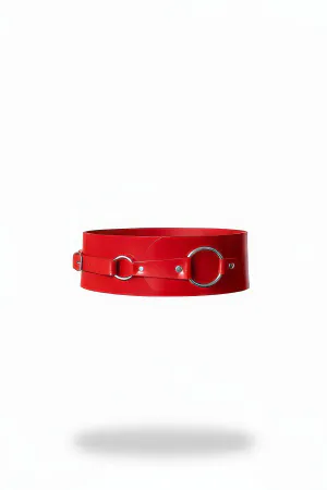 Red faux leather wide waist harness with silver O-rings and side buckle closure