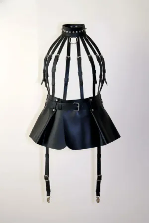 Black faux leather cage harness with studded choker and pleated mini skirt