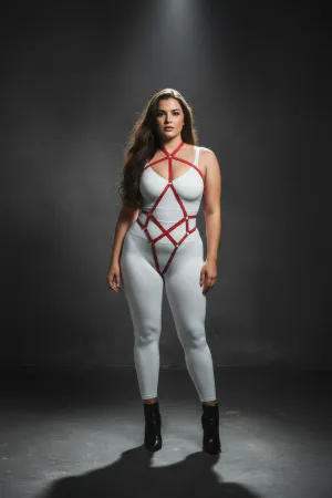 Red faux leather full body harness with adjustable straps and O-rings worn by a plus-size model.