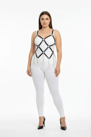 Black faux leather full body harness with diamond lattice and silver chain fringe, worn by a plus-size model
