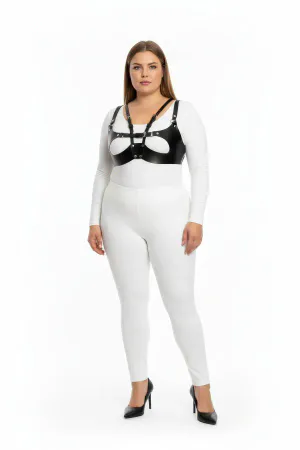 Black faux leather strappy harness bra with central O-ring detail worn by a plus-size model