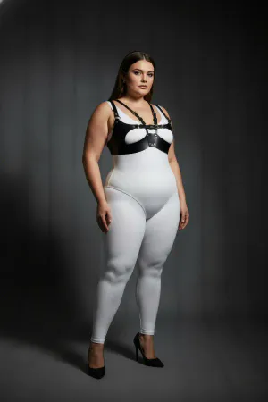 Black faux leather strappy harness bra with central O-ring detail worn by a plus-size model