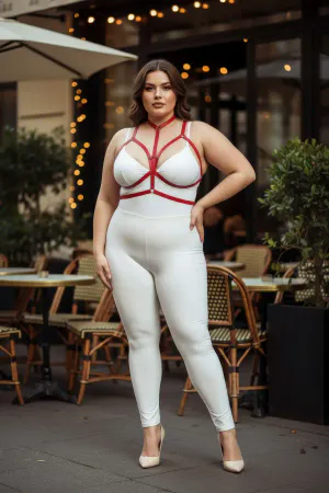 Red vegan leather body harness with adjustable straps and a central O-ring worn by a plus-size model