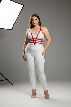 Red faux leather body harness with adjustable straps worn by a plus size model