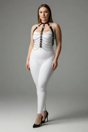 Black faux leather body harness with silver chains, worn by a plus-size model