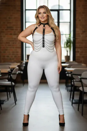 Black faux leather body harness with silver chains, worn by a plus-size model