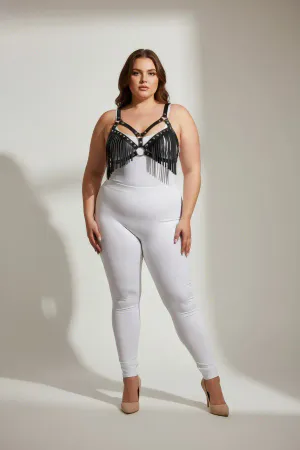 Black faux leather fringe body harness with central O-ring worn by a plus-size model.
