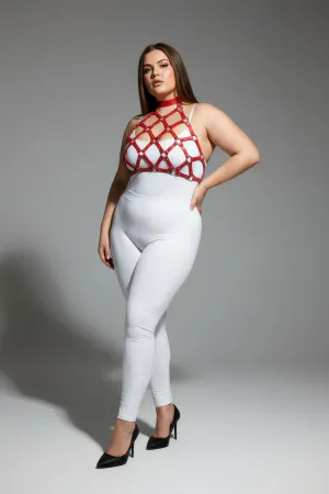 Red geometric cage halter harness with nail details worn by a plus-size model