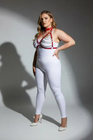 Red faux leather body harness with cascading silver chains and O-ring detail, worn by a plus-size model.