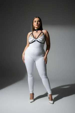 Black faux leather body harness with silver-tone chain detailing and choker collar on a plus-size model