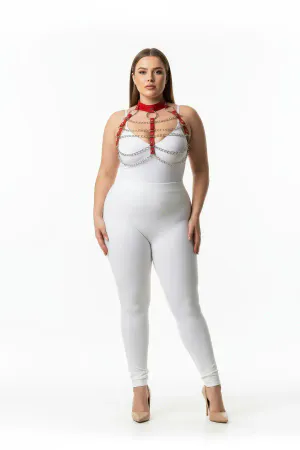 Red faux leather body harness with silver chains and O-ring detail, worn by a plus-size model.