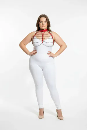 Red faux leather body harness with silver chains and O-ring detail, worn by a plus-size model.