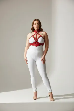 Red faux leather full body harness with integrated choker collar and silver O-ring, worn by a model.