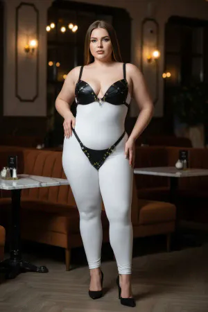 Black Studded Faux Leather Bra and Thong Harness Set on a plus-size model