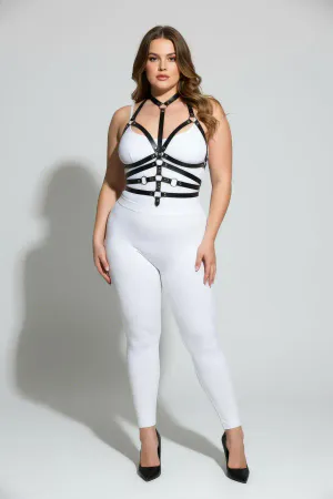 Black faux leather body harness with O-ring detail and adjustable straps worn by a plus-size model.