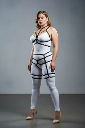 Black faux leather full body harness with collar and garter straps, worn by a model