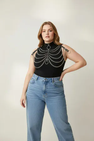 Black Faux Leather Choker Chest Harness with Draped Silver Chains on a woman wearing a white shirt
